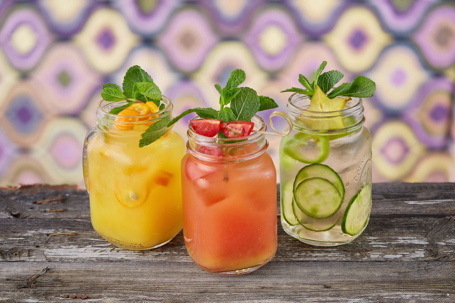 Colorful jars with lemonade