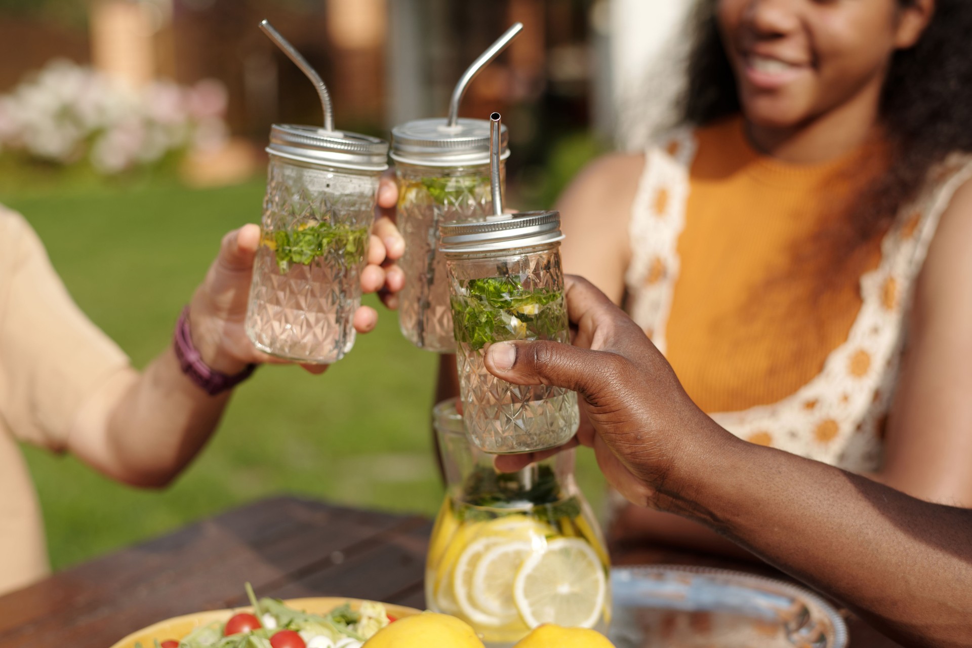 Enjoying Refreshing Mint Lemonade Outdoors Together